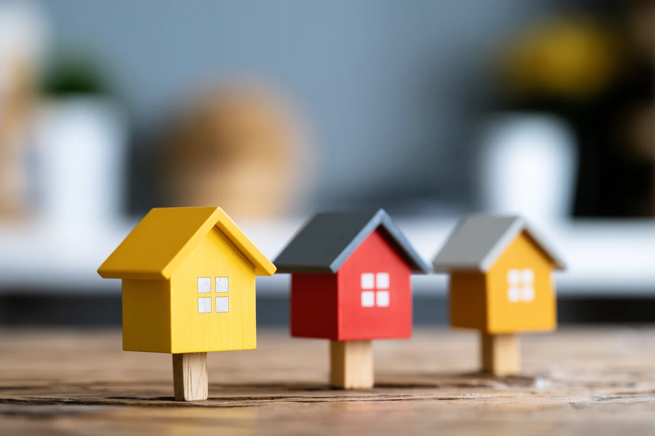 Model houses in a row, representing a rental portfolio